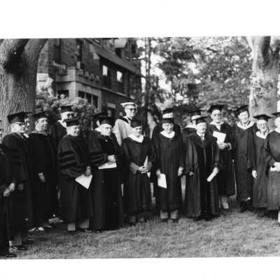 Alumni reunion of class of 1931 held on May 16, 1981. Views of alumni in cap and gown with one including Donald I. MacLean, S.J.