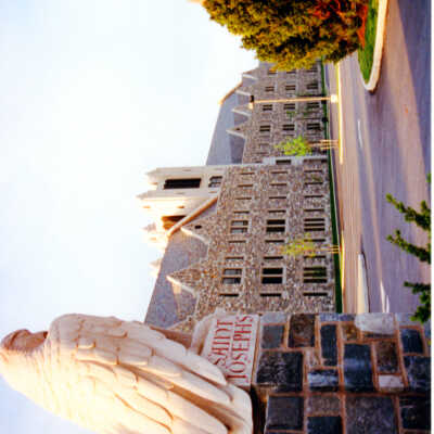 View of two carved mascot hawks in front of Mandeville Hall.