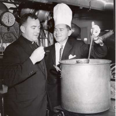 Opening of Campion and cafeteria. Paul F. X. Leary, S.J. and William F. Deal of Slater Food Service taste soup in Campion kitchen.
