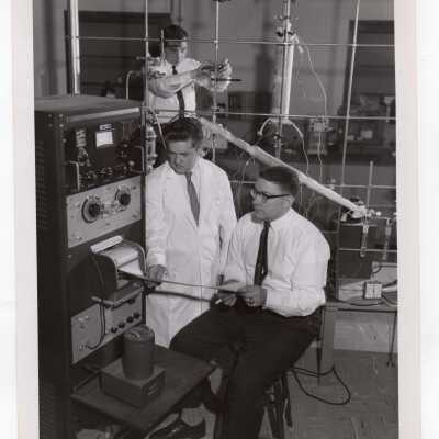 Chemistry professor, Joseph Feighan, with graduate students in science laboratory, February 1963.