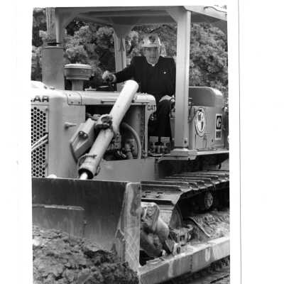 Nicholas S. Rashford, S.J. on Caterpillar bulldozer at McShain Hall groundbreaking.