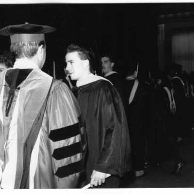Views of small groups of graduates after receiving their diplomas.