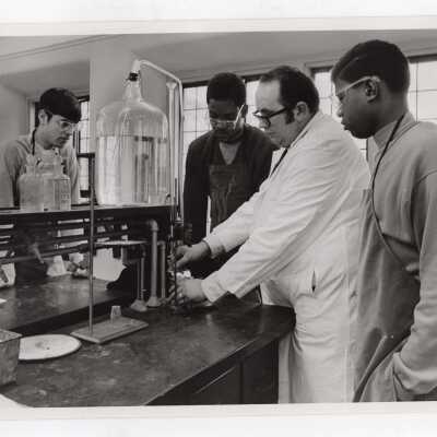Edward O'Rangers of Overbrook High School in science laboratory with several high school students participating in Chemistry Department's Science Motivation Program for high school students, May 1969.