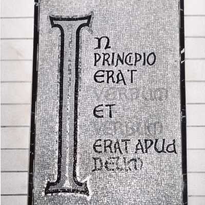 View of mosaic stating"In Principio erat Verdun et Verbum erat apud Deu" on wall in Drexel Library.