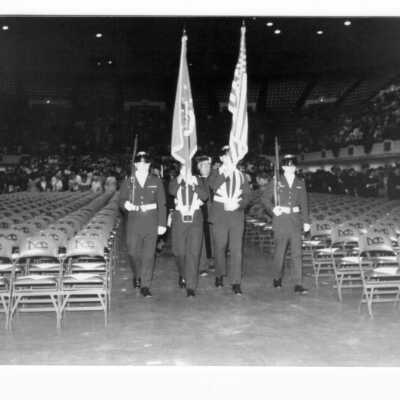 Color guard leading procession into Convention Hall, Philadelphia Civic Center during 1990 graduation/commencement.