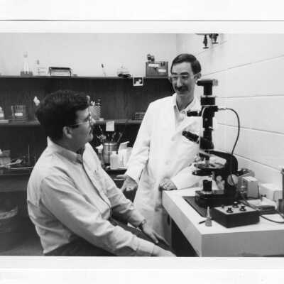 John Julian Tudor (Biology) with student in lab.