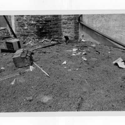 Exterior view of debris on ground outside of Simpson Hall after fire.