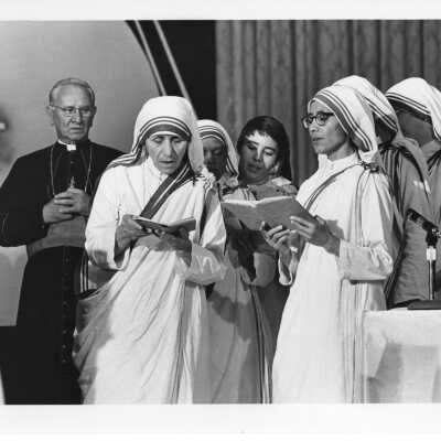 Prayers before the bread breaking ceremony during International Eucharistic Congress, symposium on hunger, August 2, 1976, held at Philadelphia Civic Center. Includes Mother Teresa, Cardinal John Krol, and others.