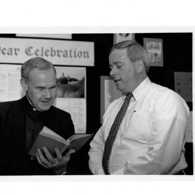 Presentation of Gerard Manley Hopkins book by Vince Gaitley (class of 1980) to Joseph Feeney, S.J. in Drexel Library.
