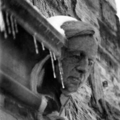 Gargoyle on exterior of Barbelin in likeness of Burchard Villiger, S.J., president of Saint Joseph's College from 1868 to 1893. Snow and ice are near the gargoyle.