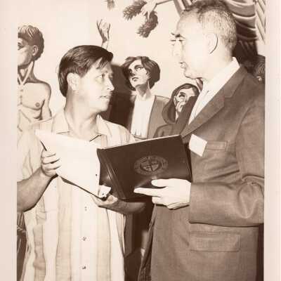 Pax Romana's 20th World Plenary Assembly meets at Saint Joseph's College. Cesar Chavez converses with Dr. Joaquin Ruiz-Gimenez, President of Pax Romana in Academy of Food Marketing Library.