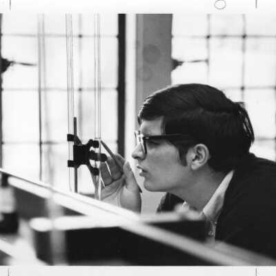 Chemistry student in Evening Division working on experiment in science laboratory, c. 1965.