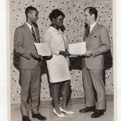 Two high school students receiving certificates of merit for participating in Chemistry Department's Science Motivation Program, spring 1968.