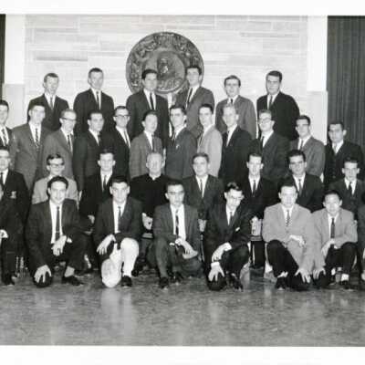 Group photo of Hawk Brothers (?) with Matthew Sullivan, S.J.
