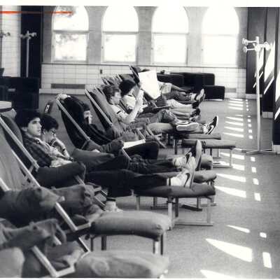 Interior view of students studying in lounge chairs in Drexel Library.