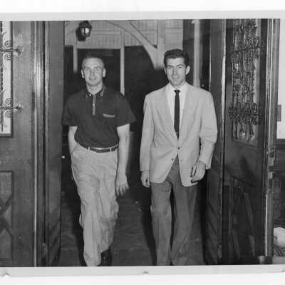 Two student residents of Quirk Hall standing in doorway.