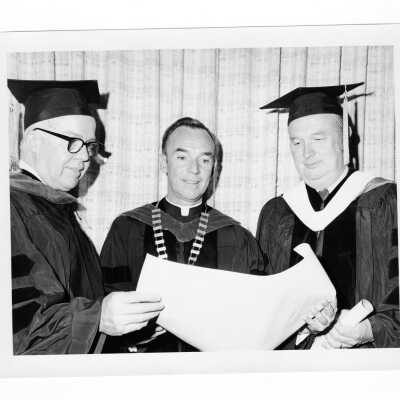 Terrence Toland, S.J., with two recipients of honorary degrees, John McConnell (?) and Donald H. McGannon (?) during 1971 graduation/commencement.