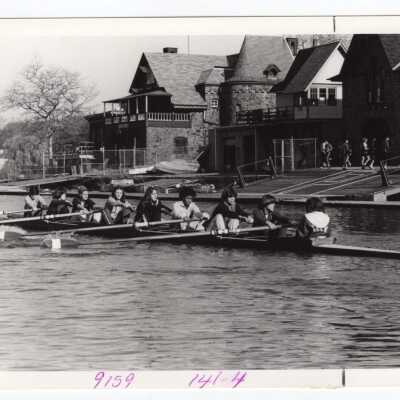 Women's crew/rowing team practicing in front of Boathouse Row on Schuylkill River.