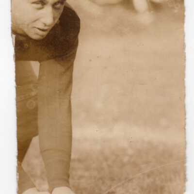 Saint Joseph's Prep football player getting ready to hike ball.