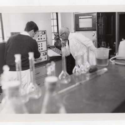 Chemistry professor, Joseph Bartlett, working with student in science laboratory, March 11, 1968.