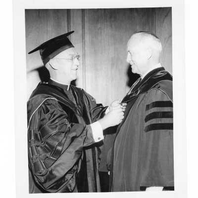 J. Joseph Bluett, S.J. with honorary degree recipient during 1959 graduation/commencement.