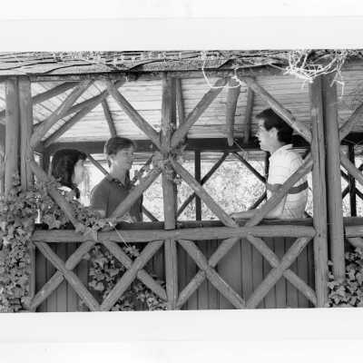 Students talking in old gazebo of Boland Hall.