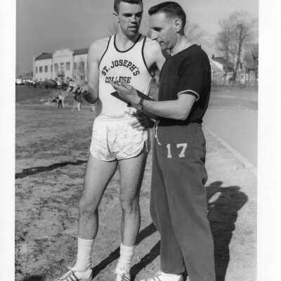 Track team member, James McDonald '62 and coach Lou Nicastro.