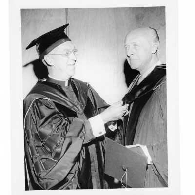 J. Joseph Bluett, S.J., with honorary degree recipient during 1959 graduation/commencement.