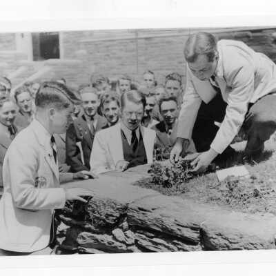 Students at ceremonial planting of ivy during Junior Week activities.