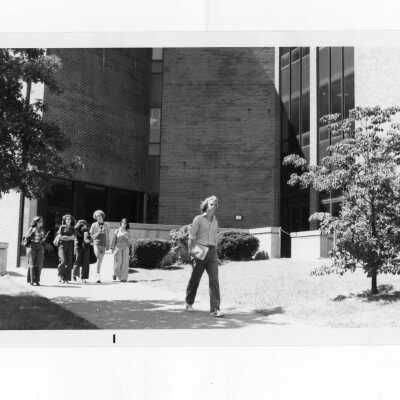Students walking alongside science center.