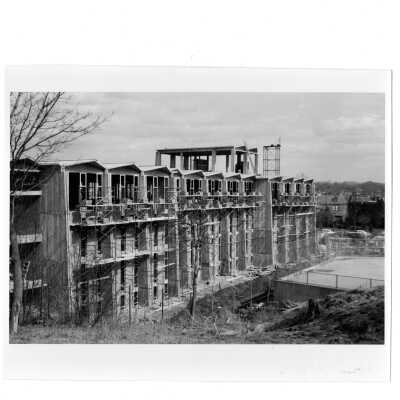 View of Bellarmine under construction with neighborhood in background.