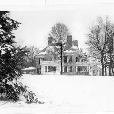 Exterior view of Loyola Hall, Jesuit residence in snow.