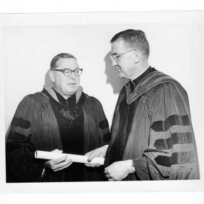 William F. Maloney with honorary degree recipient, Howard C. Petersen during October 1962 graduation/commencement.