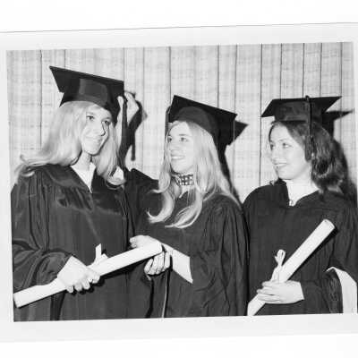 Three women graduates during 1971 graduation/commencement.