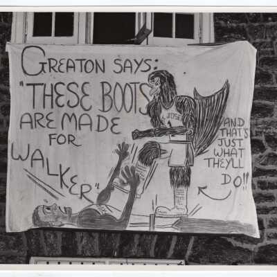 Men's Basketball banner hanging outside Greaton Residence Hall
