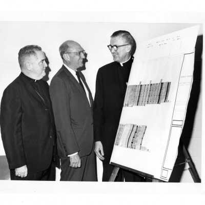 William F. Maloney, S.J. and others discussing plans for new science center.