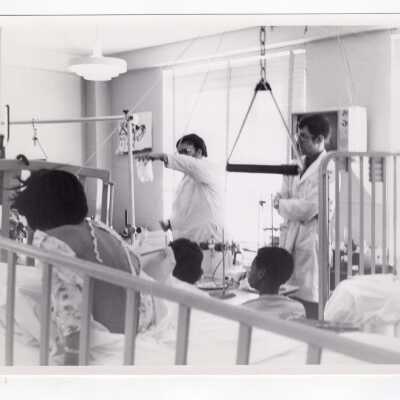 Thomas Dolan and Peter Burghart of Molloy Chemical Society conducting experiments and demonstrations for children who were patients at Children's Hospital of Philadelphia, 1971.