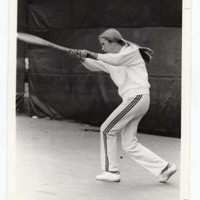 Women's tennis player practicing.