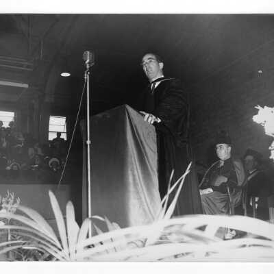 Honorary degree recipient Francis C. Nash addressing graduating students during 1952 graduation/commencement ceremony.