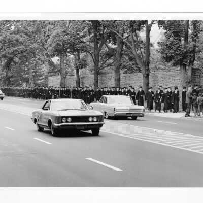 Graduates processing along City Avenue on way to 1968 graduation/commencement on Gest Lawn.