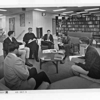 Jerome Coll, S.J., holding Honors Program class in Drexel Library, c. 1968.