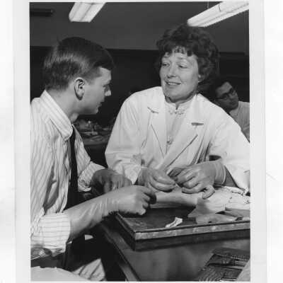 Catherine "Kay" Nash (Biology) working with student in laboratory.