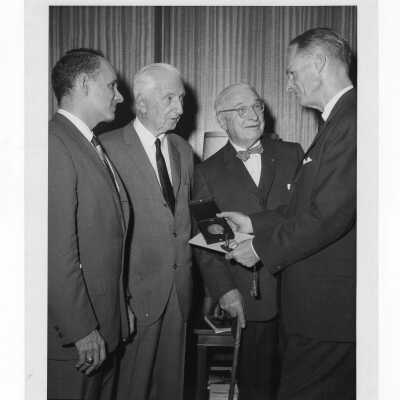 Shaffrey award recipient, Dr. Thomas M. Durant, showing medal and certificate to past award recipients, including Dr. Truman Schnabel, Dr. Alfred Bongiovanni, and Dr. William N. Parkinson, April 17,1966.