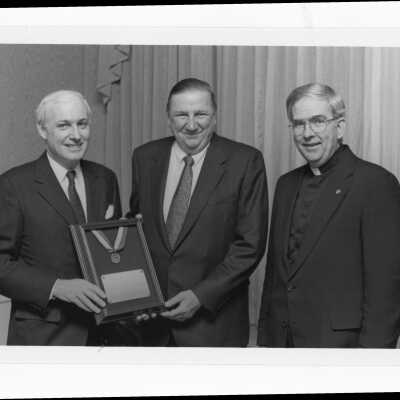 Nicholas S. Rashford, S.J.,with Bernard A. Scally, III, recipient of Bartholomew A. Sheehan, S.J. Award (formerly Crim-Gray Award) at Law Alumni dinner, September 10, 1987.