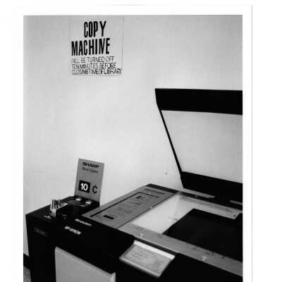 View of copy machine in Drexel Library with sign indicating ten cents per copy.