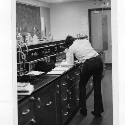 Student working in science laboratory.