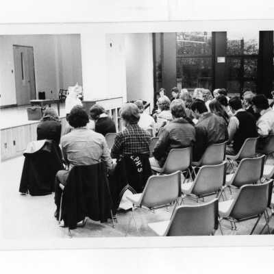 Students listening to lecture in science center auditorium.