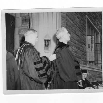 John J. Long, S.J., with honorary degree recipients, Brother Emilian James, Frank M. Folsom, Father McGuire, during 1948 graduation commencement in Barbelin quadrangle. (Four black and white photographs.)