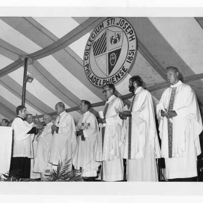 Mass held July 31, 1976, on Gest Lawn prior to academic convocation during SJC 125th anniversary celebration with Cardinal John Krol, Terrence Toland, S.J., Donald I. MacLean, S.J., Apostolic Delegate Jean Jadot, and others.