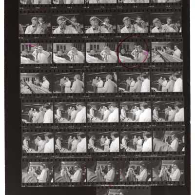 Views of students and professor in glass blowing course offered by Chemistry Department, c. 1965.
